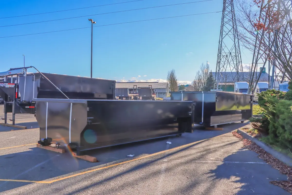 Roll-off dumpster ready for waste disposal at job site for 3 Yard Dumpster Rental in Marietta